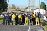 Firefighting crews assemble to contain the Substation Fire burning east of The Dalles, Ore.