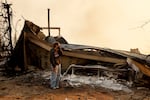 Fallon Prockiw-Kline gets emotional in front of her home which was damaged by the Palisades Fire, Wednesday, Jan. 8, 2025, in Malibu, Calif.