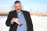 Jason Patrick, seen here holding his pocket Constitution during the early days of the armed takeover of the Malheur National Wildlife Refuge, is one of seven defendants currently awaiting trial for their roles in the occupation.