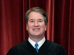 Associate Justice Brett Kavanaugh stands during a group photo at the Supreme Court in Washington last year.