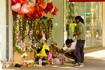 Mourners visit a memorial to victims of the April 3 mass shooting in Sacramento.