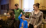 Evelyn, Chet, Alden and Claire Liew in their home in Bend.