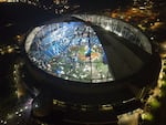 An aerial view of Tropicana Field's shredded roof in downtown St. Petersburg, Fla., in the wake of Hurricane Milton.