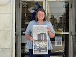 Rose Scoggins, editor of the local newspaper, with a special edition the paper put out after the monument was bombed earlier this month.