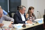 Clark County Charter Review Commission Chair Brandon Erickson, center, reads a series of proposed amendments during a meeting at the Clark County Public Service Center in Vancouver, Wash. on July 8, 2026. The amendments include a proposal that could make it harder to raise local taxes.