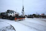 A snowplow clears the road in Portland
