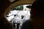 Covered wagon driver Brian Cook shares his knowledge of mules and the Oregon Trail during the drive.