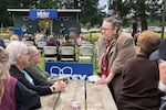 Betsy Johnson talks to supporters at a pep rally in St. Helens, Ore., on June 14, 2022. As an unaffiliated candidate for governor, Johnson is hoping to collect enough signatures to make the November ballot.