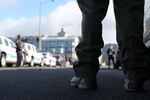 A law enforcement officer watches as Sgt. Jason Goodding’s family enters the Seaside Convention Center.