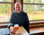Father Martin tastes a new batch of beer and ponders the flavor profile at Mount Angel Abbey in Mount Angel, Ore., on Sept. 18, 2025.