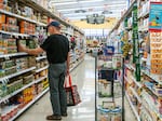 A customer shops in a grocery store on July 15 in Houston, Texas. The drop in gas prices in parts of the country could bring some relief to the inflation rate, although consumer prices still remain high.