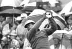 Lee Elder watches the flight of his ball as he tees off in the first round of play at the Masters in Augusta, Ga., in this April 10, 1975, file photo. Elder broke down racial barriers as the first Black golfer to play in the Masters and paved the way for Tiger Woods and others to follow. 