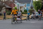 The bikers of Portland's Pedalpalooza Star Trek ride arrive at Woodstock Park in Southeast Portland led by Joe Gavrilovich, dressed as Captain Kirk and holding up the Vulcan hand sign for "Live long and prosper," on Thursday, August 5, 2021.