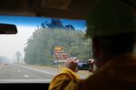 A press convoy moves along Highway 84 toward Multnomah Falls with fire officials.