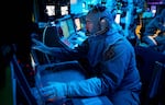 Chief Fire Controlman Kenneth Krull works at the combat information center on the USS Carney in the eastern Mediterranean in October. The ship was involved in shooting down a drone launched from Yemen in November. Houthi militants in Yemen have been firing on commercial ships the past two months. The photo was provided by the U.S. Navy.