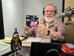 JT Griffith holds a 7-inch single by Mahalia Jackson called "Songs for Christmas Vol. 2" in the OPB studios. Griffith is the founder of LIMINAL Music and has been OPB’s guide to the niche genre of holiday music for the past four years.