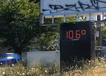 A digital temperature sign on northeast Lombard Street reads 106 degrees, Portland, Ore., July 9, 2024. After several days of above-average heat, temperatures in Portland reached triple digits on Tuesday. Areas like northeast Lombard, which have comparably low tree cover, often register higher temperatures than other parts of the city. 