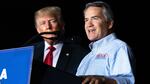 Georgia Rep. Jody Hice speaks during a rally last September as former President Donald Trump looks on. Trump endorsed Hice, who falsely believes fraud tainted the 2020 election, in the Georgia secretary of state race, but Hice was defeated.