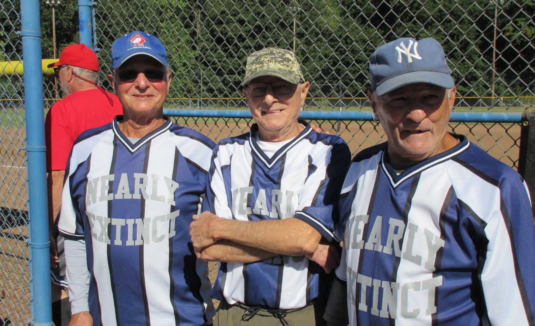 Jerry, Ed, and Bob (pictured left to right) play softball on Saturday, Aug. 2, 2025 for their team, Nearly Extinct, based in Federal Way, Washington.
