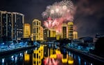 Fireworks explode over buildings during New Year's celebrations in Manila, Philippines.