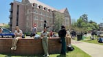 Florida State University students wait for news amid an active shooter incident at the school’s campus in Tallahassee, Fla., on Thursday.