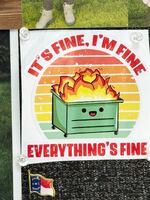 Yancey County elections director Mary Beth Tipton has two stickers in her office that describe what it's like running elections, but the smiling cartoon dumpster that says "It's fine, I'm fine, everything is fine" has taken extra meaning in recent weeks.