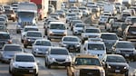 Heavy afternoon traffic moves along the I-5 freeway in Los Angeles. The more people that take mass transit, the less-crowded roads like this one can become. That benefits motorists and transit riders alike.