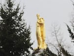 The Oregon Pioneer, or "Gold Man," stands atop the Oregon Capitol in Salem.