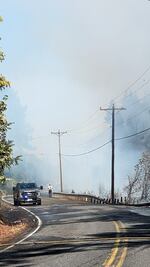 In this photo from the White Salmon Fire Department, crew work to control the Tunnel 5 Fire in Skamania County, Wash., on July 2, 2023.