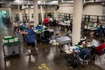 In this Nov. 3, 2020 file photo, election workers organize ballots at the Multnomah County Elections Division in Portland, Ore. Oregon's elections director was abruptly fired in a text message by the secretary of state after he pointed out serious issues with the state's aging and vulnerable technology for running elections.