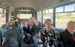 Some of the regular riders on Christmas Valley shopper bus. In center is OPB 'Weekend Edition' host Lillian Karabaic, who joins for one of the rides. Rider Bobbie Nicoliadis (in pink shirt) says Christmas Valley is a close-knit community, “Especially this bus, we are like family.”