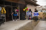 Granddaughter Jamie Yutzie and daughter Carolee Brown wait for Bill Lapschies, who is 104 and may be the world's oldest coronavirus survivor.