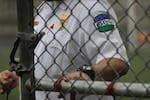 FILE - A patch is shown on the uniform of a guard with the GEO Group Inc. during a media tour of the U.S. Immigration and Customs Enforcement detention center Dec. 16, 2019, in Tacoma, Wash. The GEO Group is the private company that operates the center for the U.S. government.