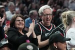 Oregon Gov. Tina Kotek, right, reacts after a play during the second half of a WNBA basketball game between the Portland Fire and the Chicago Sky, Saturday, May 9, 2026, in Portland, Ore. (AP Photo/Jenny Kane)