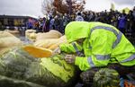 As crowds gathered around the lake, the pumpkin growers prepped and decorated their veggie boats. 