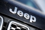 The Jeep logo is seen in the south Denver suburb of Englewood, Colo., on April 15, 2018. Chrysler is recalling more than 330,00 Jeep Grand Cherokees because of a steering wheel issue that may cause drivers to lose control of their vehicles.