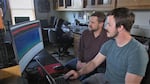 Using artificial-intelligence technology and Oregon State University's super computer, Damon Lesmeister and research assistant Zach Ruff train their computer to process millions of forest noises and to interpret which are actually the calls of spotted owls. 
