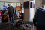 Larry Krause stands in his flooded home on the Clackamas River in Eagle Creek, Ore., on Friday, Dec. 19, 2025. The longtime resident piled items onto tables, shelves and countertops when he received the flood warning late last night.