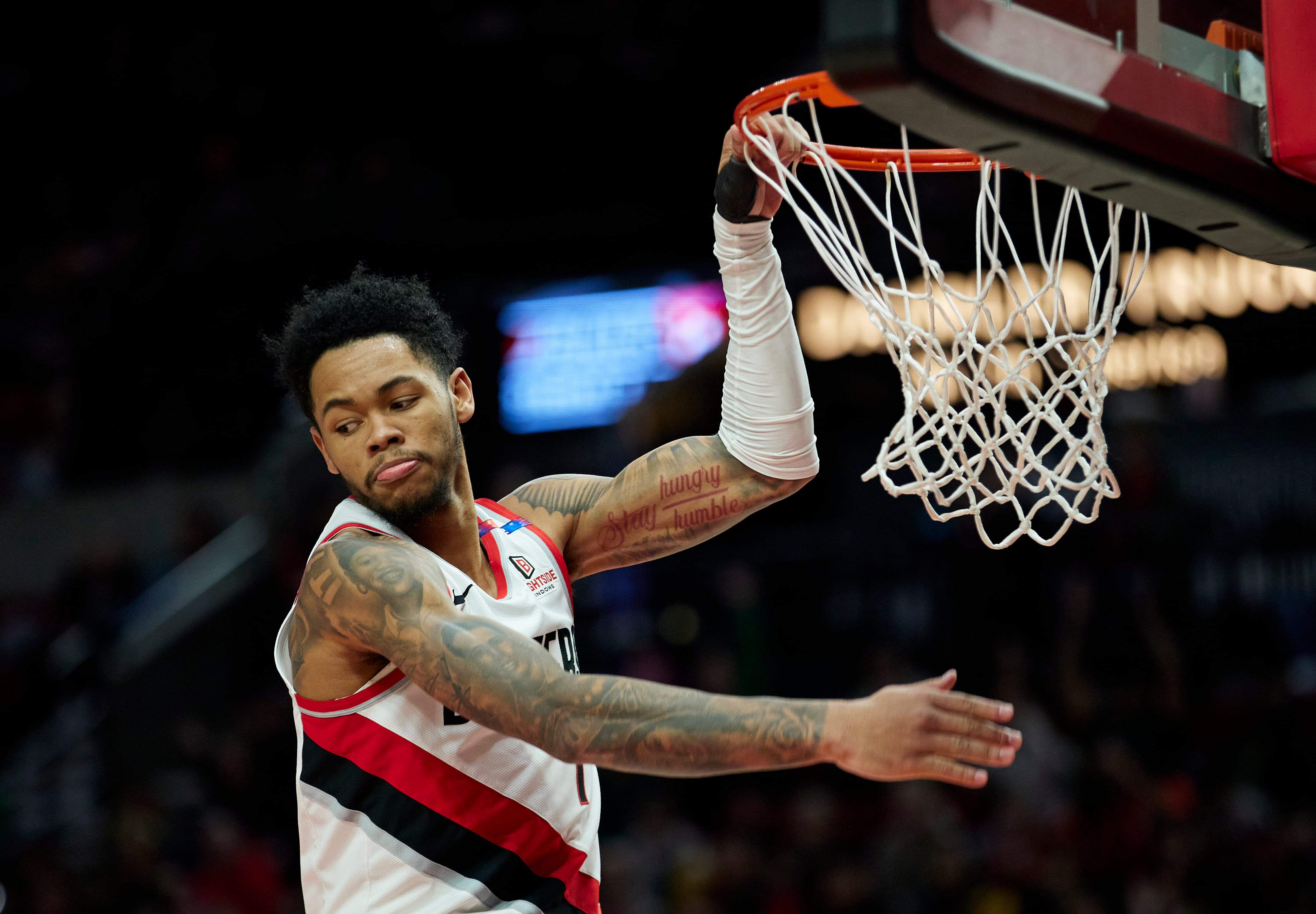 Portland Trail Blazers guard Anfernee Simons dunks against the Washington Wizards during the second half of an NBA basketball game in Portland, Ore., Monday, March 17, 2025. (AP Photo/Craig Mitchelldyer)