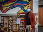 Verónica Gutiérrez poses for a portrait in front of her food cart, La Arepa, at the Portland Mercado in SE Portland, Ore., on Wednesday, May 20, 2020. La Arepa specializes in Venezuelan cuisine.