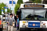 Passengers exit a TriMet bus.