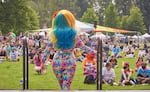 A drag queen faces the crowd at a Eugene Pride event.