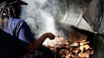 Jamaican Jerk Chicken cooks on the charcoal grill during the Notting Hill Carnival in 2006 in London.
