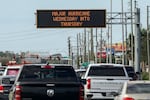 Highway signage announces the impending arrival of Hurricane Milton and the evacuation zones on Tuesday in Port Richey, Fla.