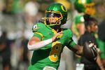 Oregon quarterback Dillon Gabriel warms up before an NCAA college football game against Idaho, Saturday, Aug. 31, 2024, in Eugene, Ore.