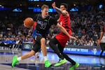 Dallas Mavericks forward Cooper Flagg (32) drives to the basket against Portland Trail Blazers forward Toumani Camara (33) during the second half of an NBA basketball game Sunday, Nov. 16, 2025, in Dallas.