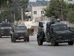 Israeli armoured vehicles move on a street during a military operation in the West Bank city of Jenin, Wednesday, Aug. 28, 2024. 