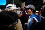 Following a talk by Turning Point USA founder Charlie Kirk, supporters clashed with University of Washington students and protesters who barricaded the east entrance to the encampment for Palestine on the Quad on Tuesday, May 7, 2024, in Seattle.
