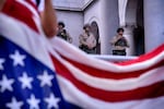 Los Angeles: Los Angeles Sheriff's deputies stand guard on the steps of Los Angeles City Hall as protesters assemble.