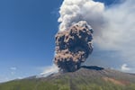 Smoke rises from the crater of the Etna volcano as it erupts, on Mount Etna near Catania, Italy, on Monday. A huge plume of ash, gas and rock spewed forth from Europe's highest active volcano.